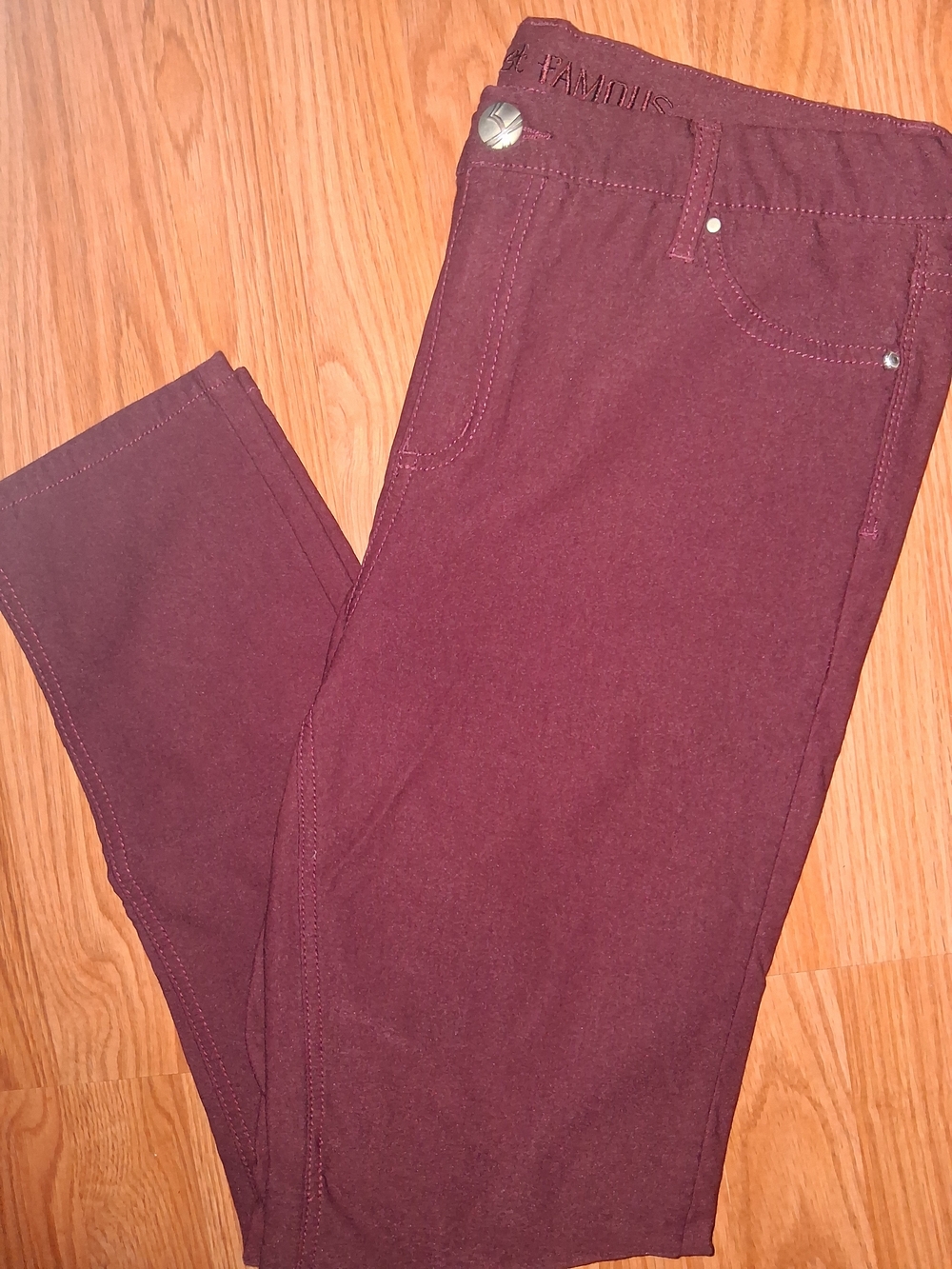 Almost Famous wine-colored leggings with embroidered logo